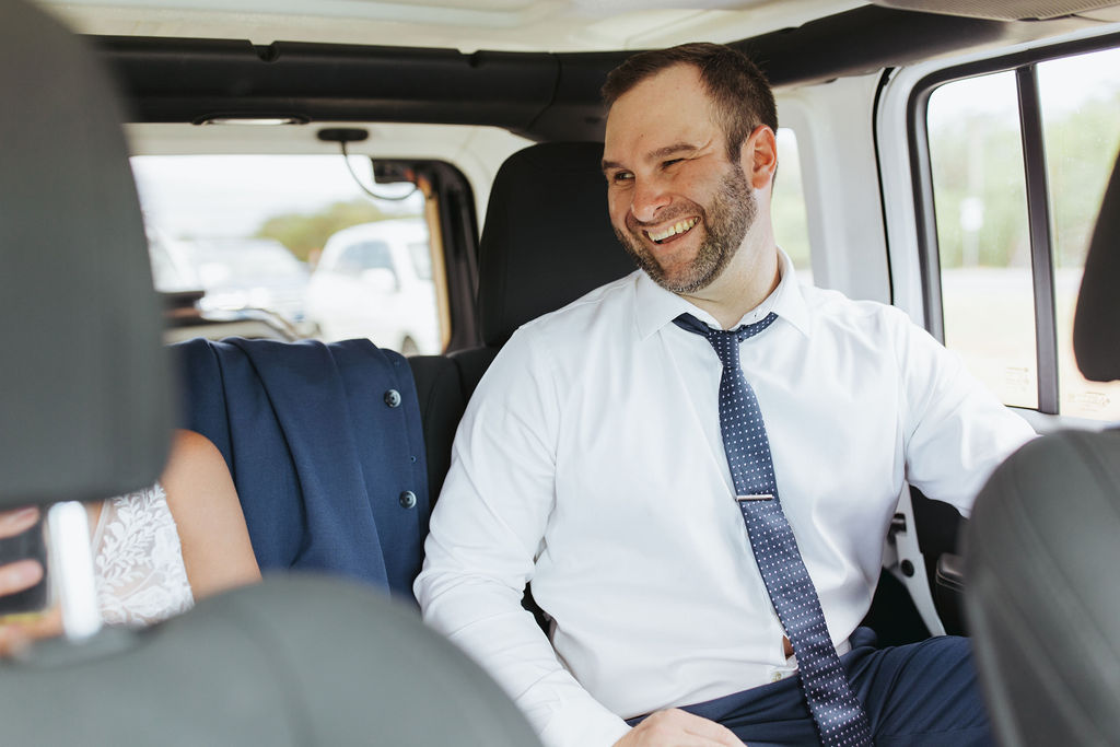 groom in jeep with bride