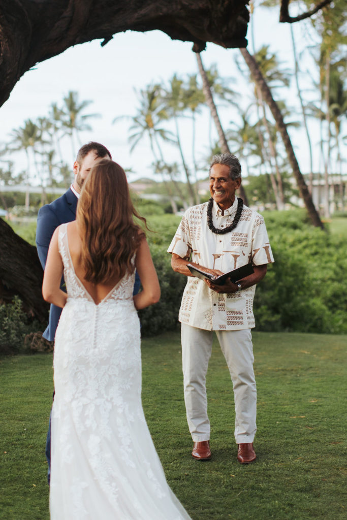 bride and groom with officiant during maui elopement ceremony