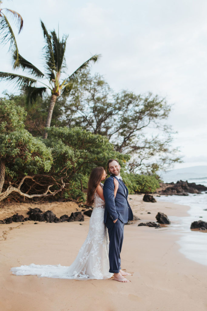 bride and groom portraits on beach in hawaii