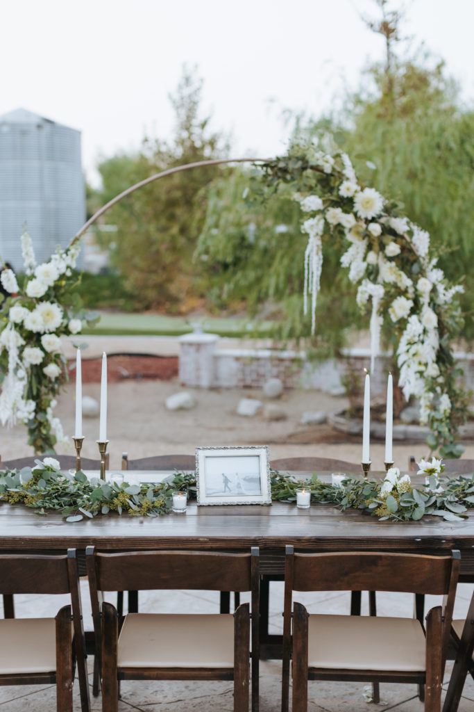 temecula wedding reception table with candles and greenery