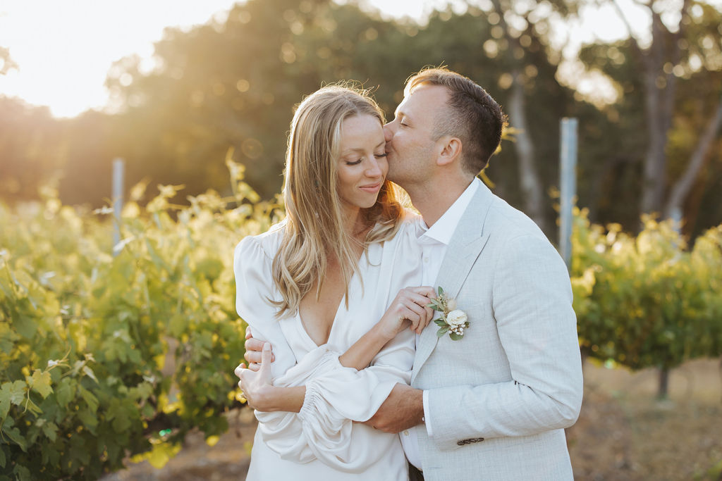 bride and groom sunset portraits in california vineyard