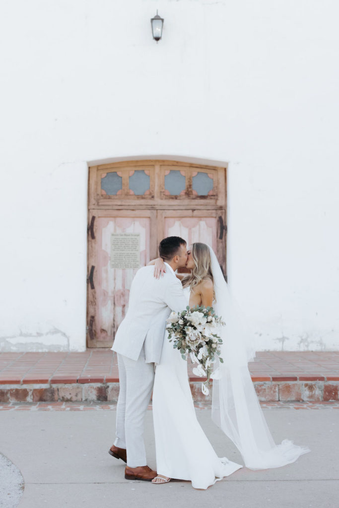 bride and groom at mission san miguel ceremony