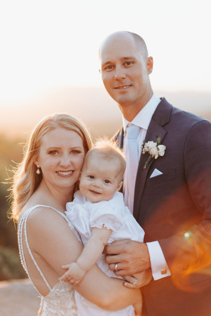 bride and groom with baby in yosemite wedding