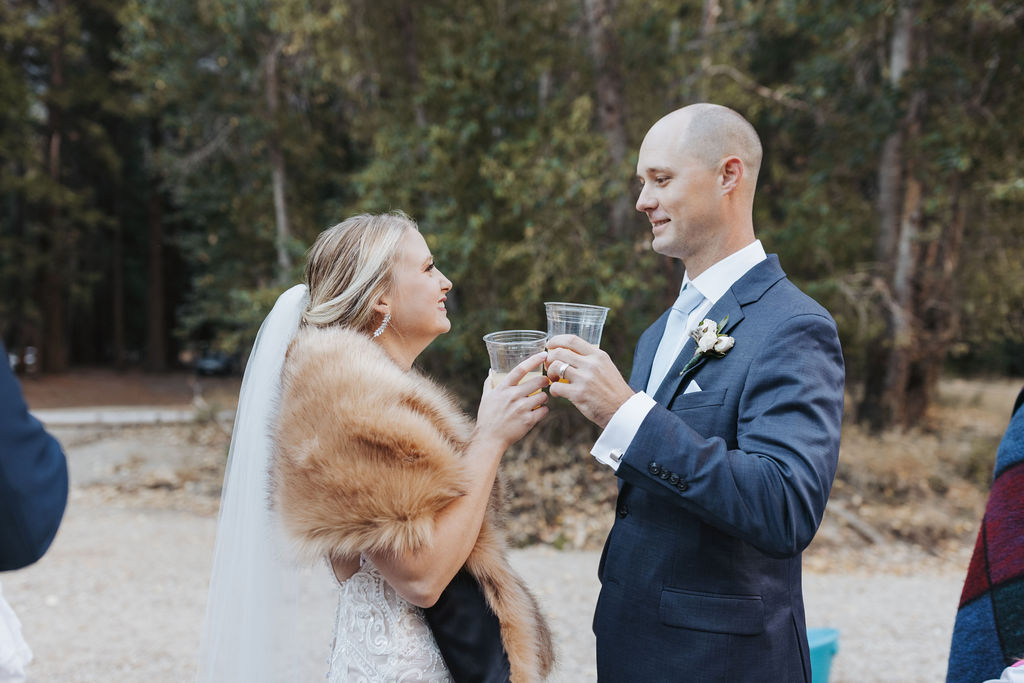 bride and groom with mimosas in yosemite