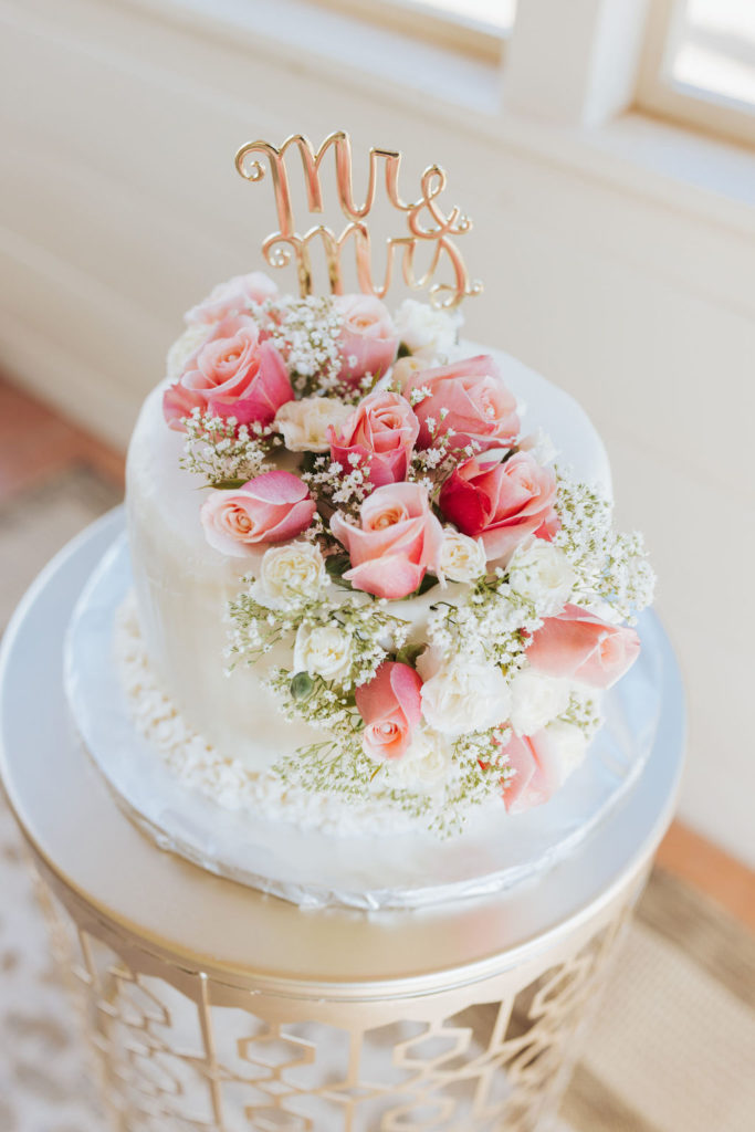 sedona arizona elopement cake with roses and gold topper