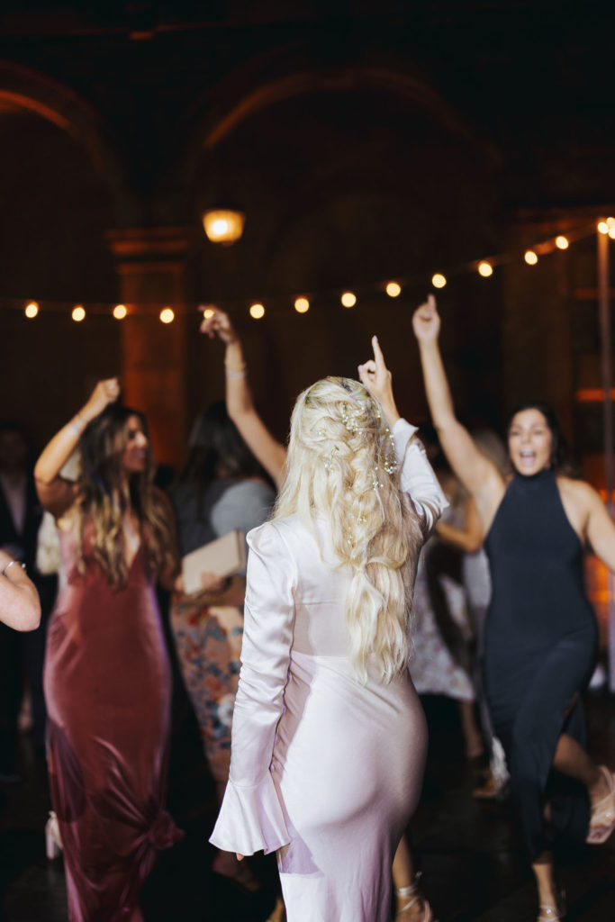 bride dancing with guests at crane estate reception