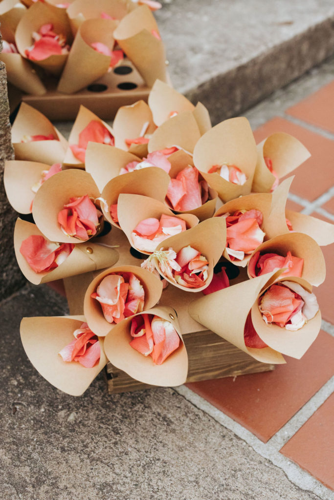 rose petals in paper cones at luxury wedding