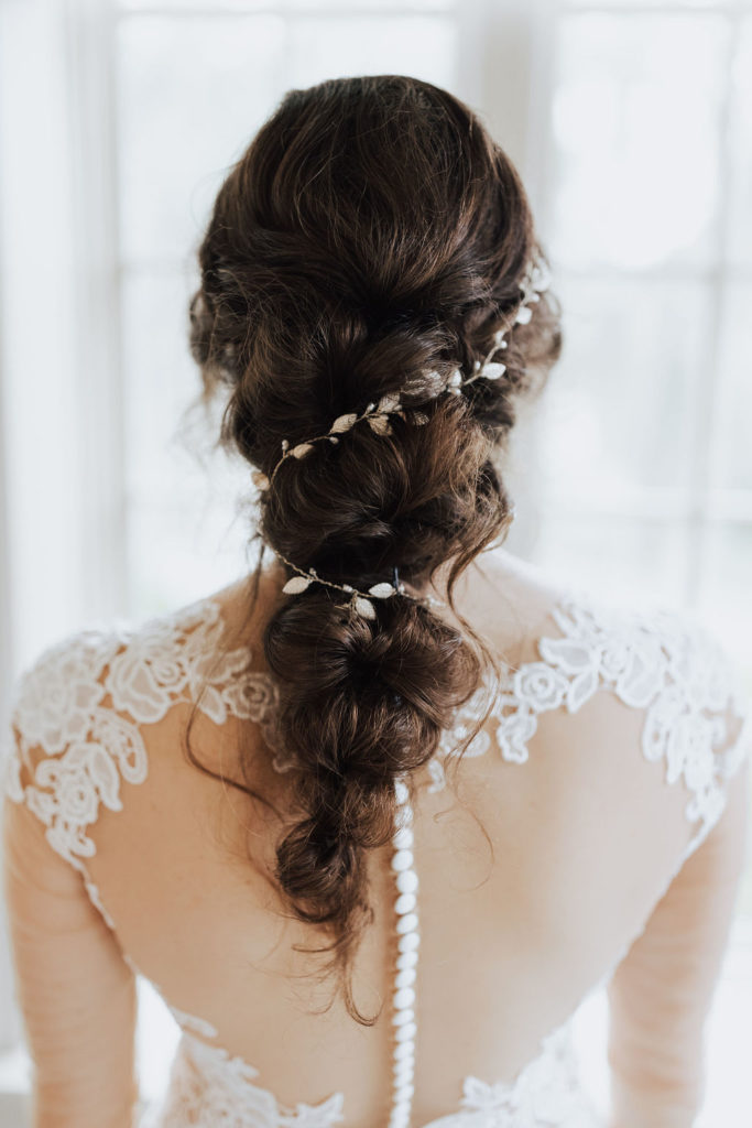 bridal braided hair with flowers for boho wedding