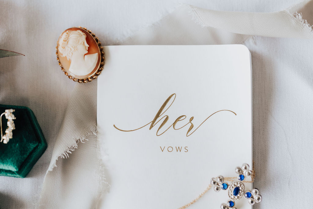 boho wedding vow book and jewelry