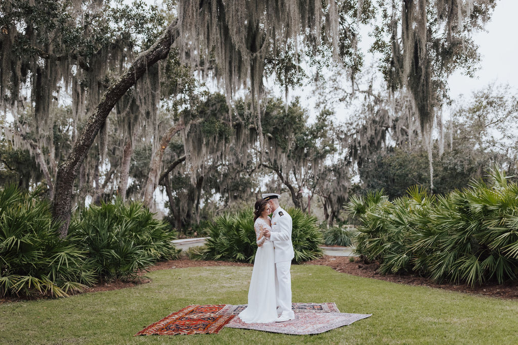 bride and groom dancing on vintage rugs