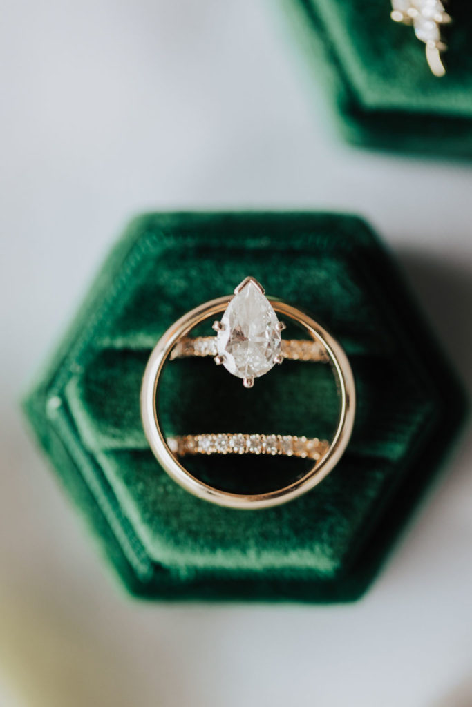 wedding rings in emerald green velvet ring box