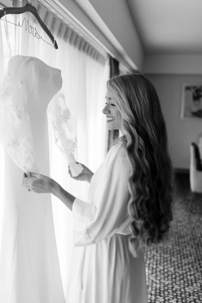 bride getting ready for white wedding chapel ceremony