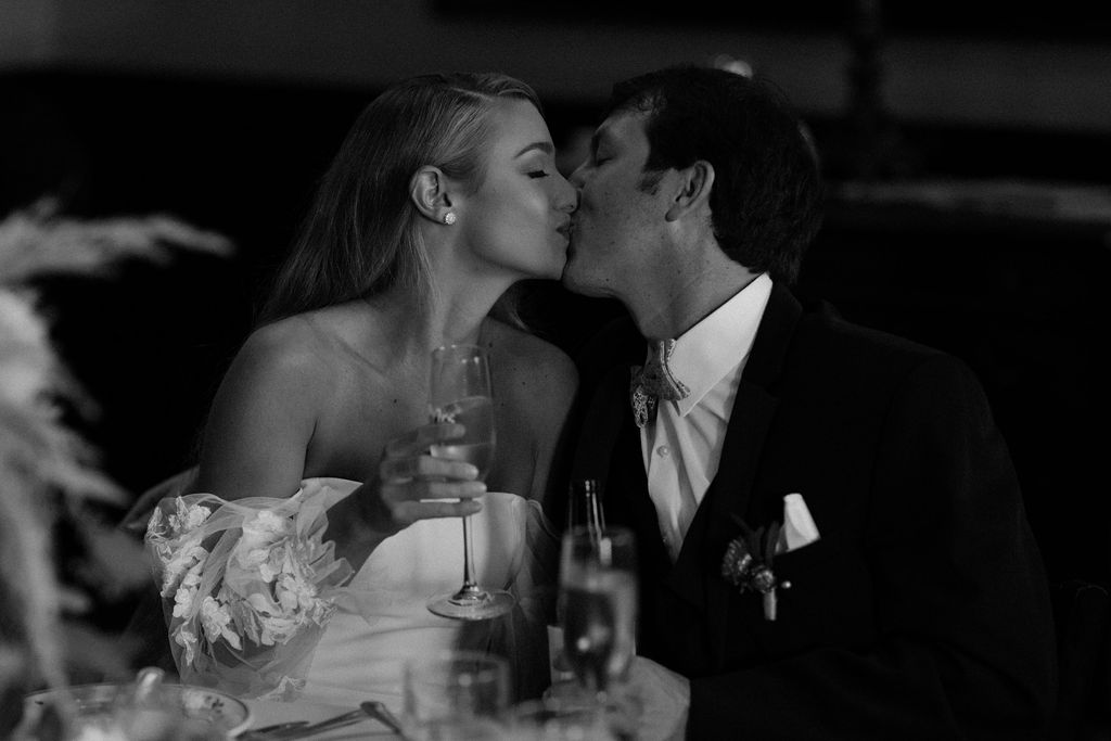 bride and groom kissing at las vegas wedding reception