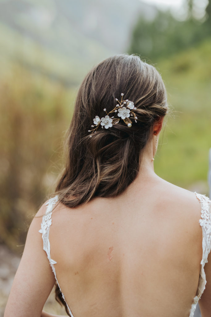 bridal hair with floral pin