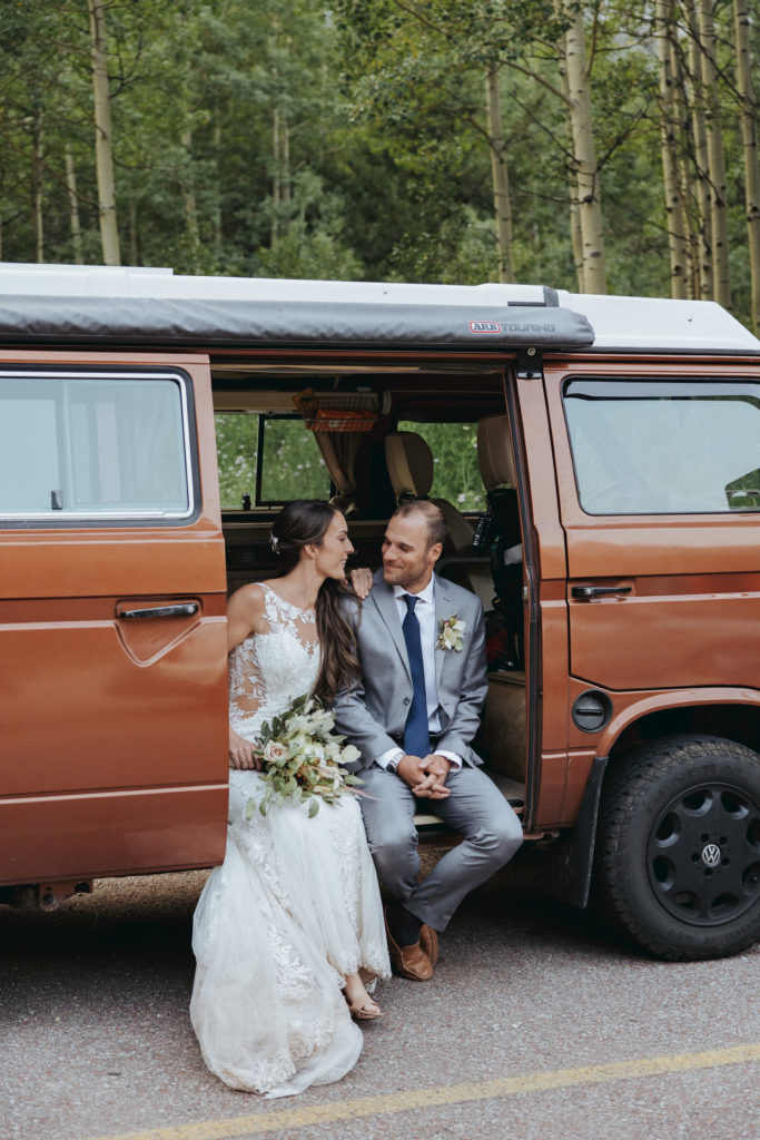 bride and groom portraits in adventure van in maroon bells colorado