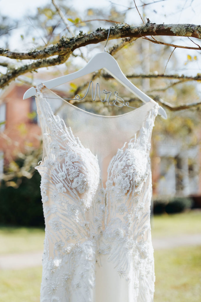 wedding dress hanging on a tree branch