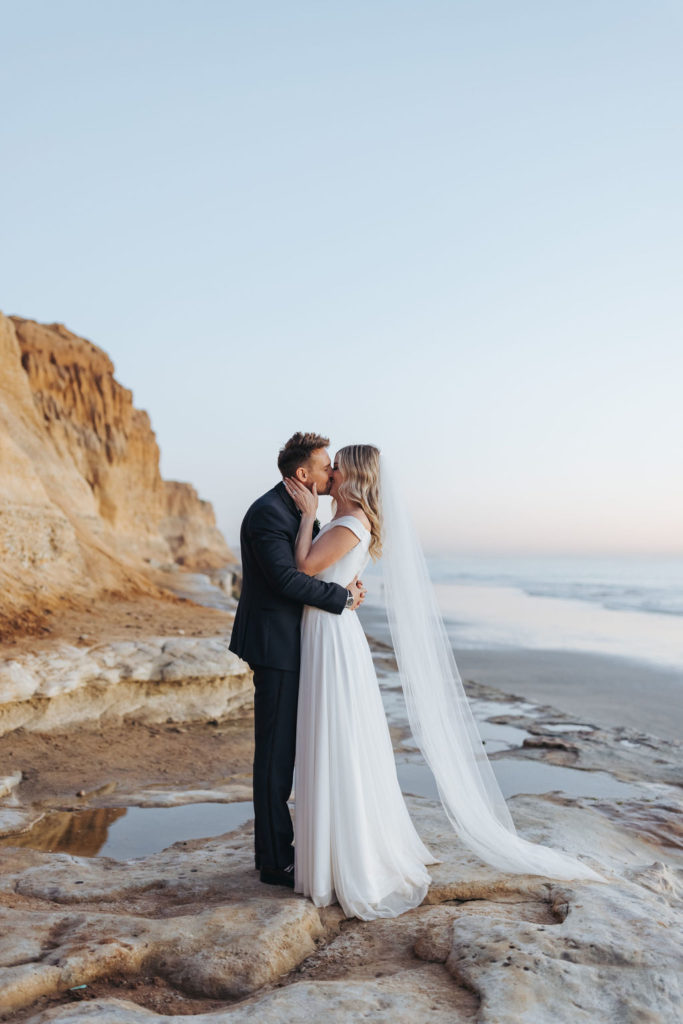 bride and groom portraits on the beach in los angeles