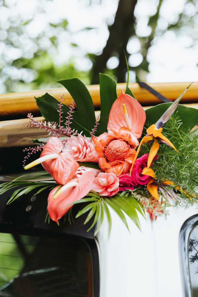tropical bridal bouquet on top of jeep