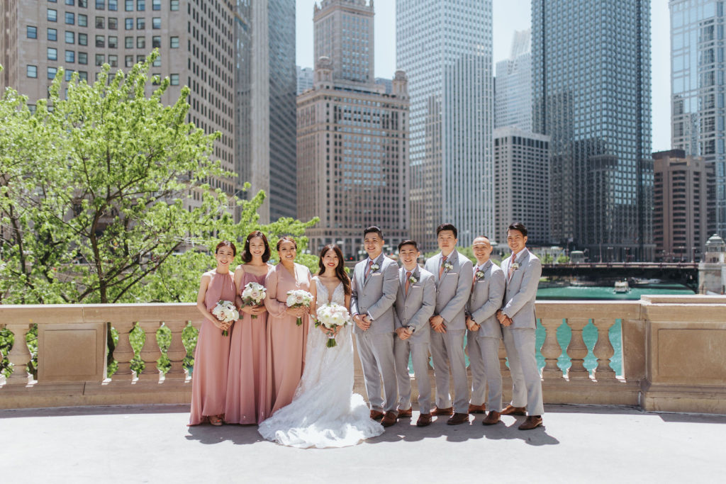 bride and groom with wedding party in downtown chicago