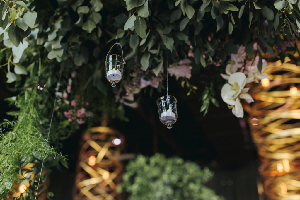 hanging candle votives in the geraghty wedding venue