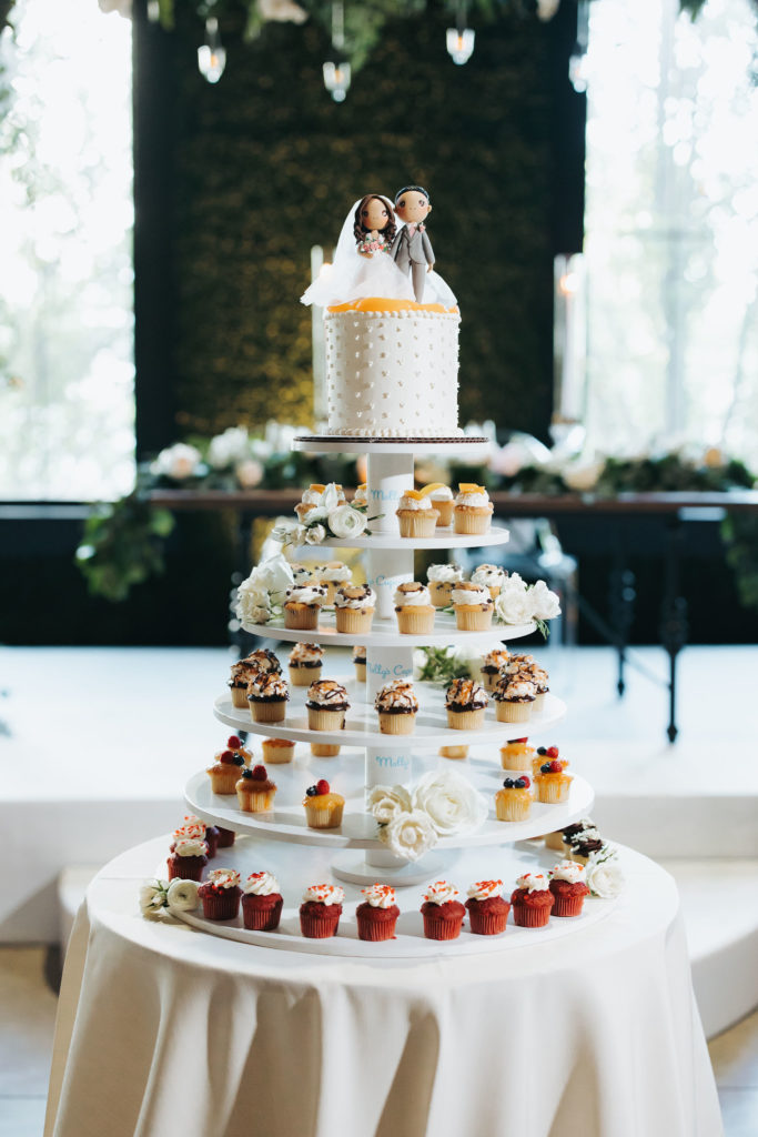 wedding cake with cupcakes and custom topper