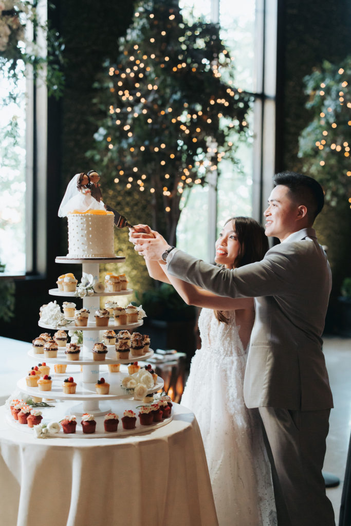 bride and groom cutting cake at geraghty wedding reception