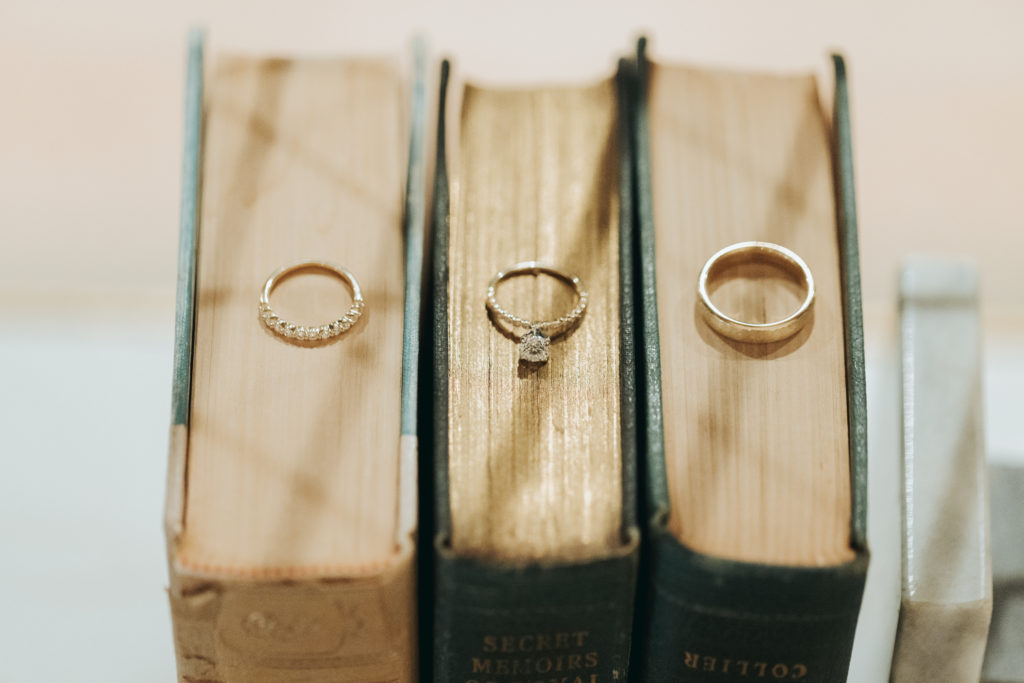 wedding rings on antique books