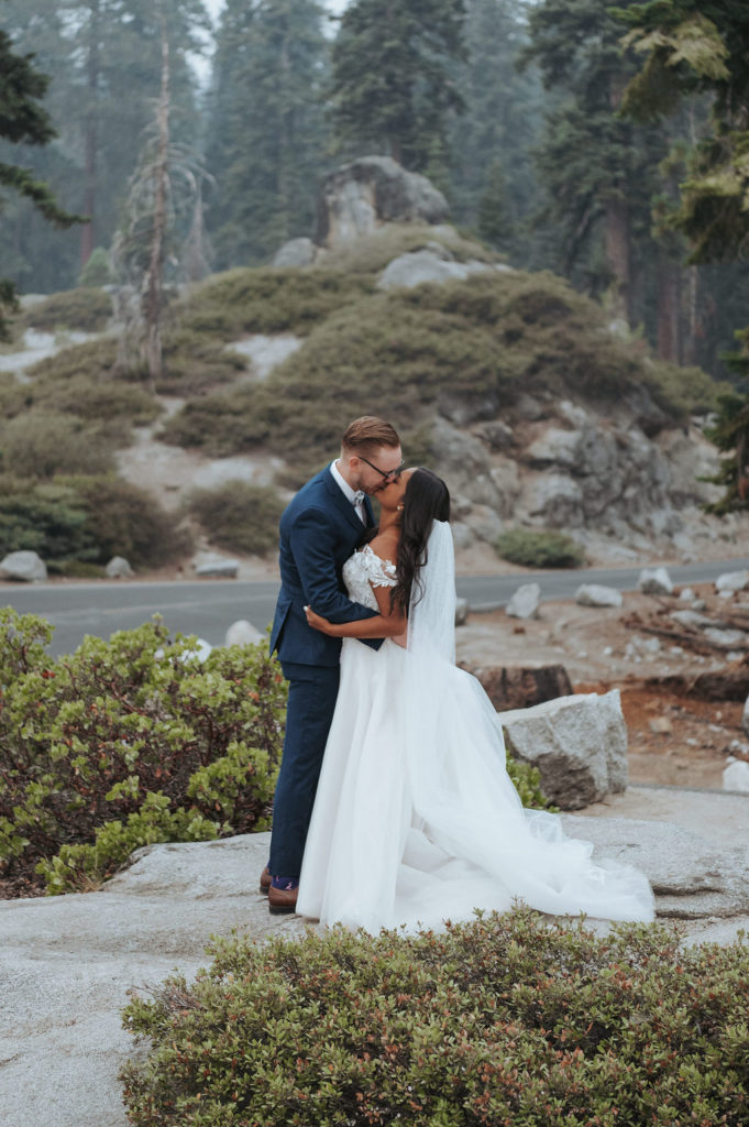 bride and groom kissing in yosemite elopement