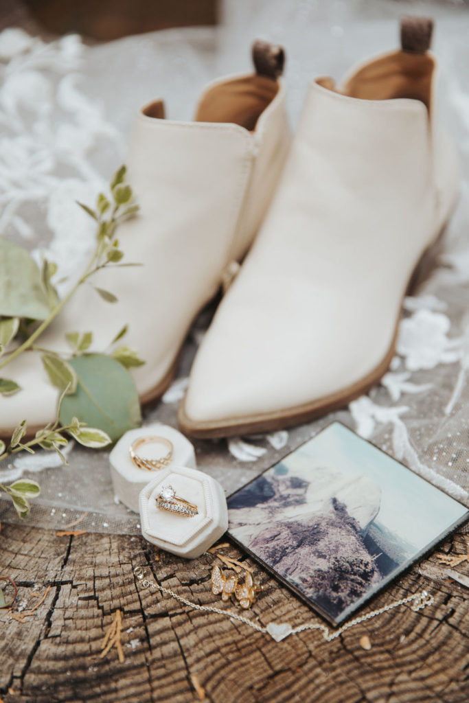 wedding rings, bouquet and white bridal boots