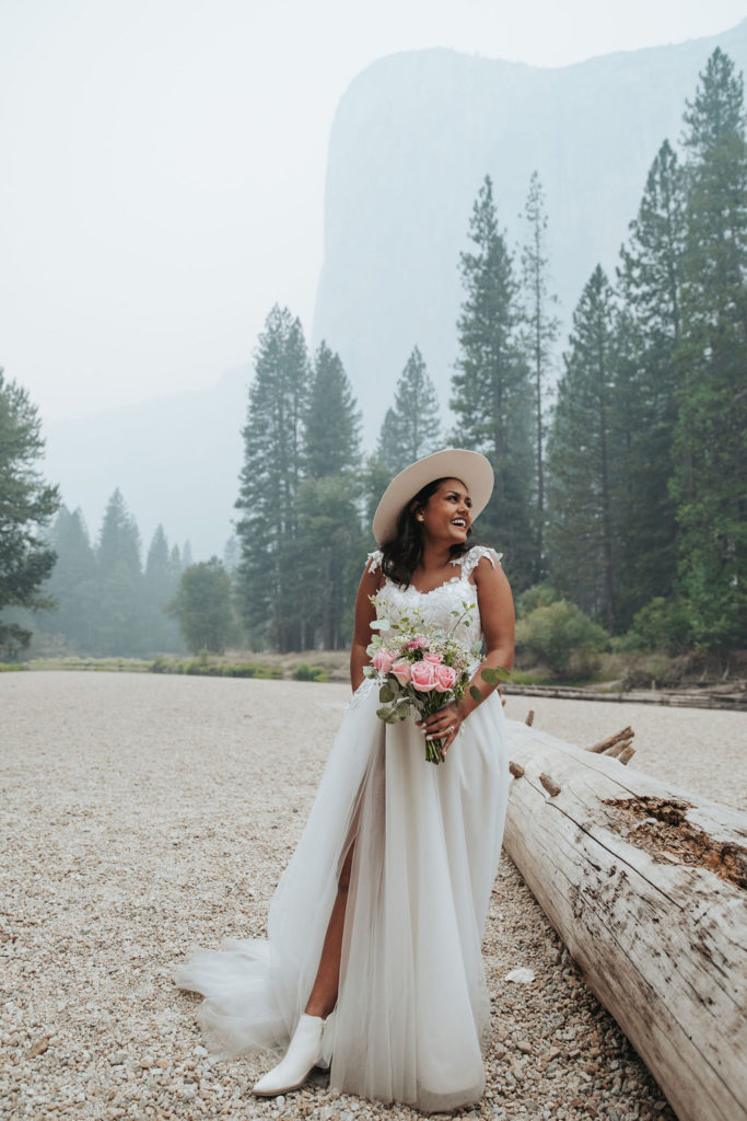 bride wearing hat in yosemite elopement