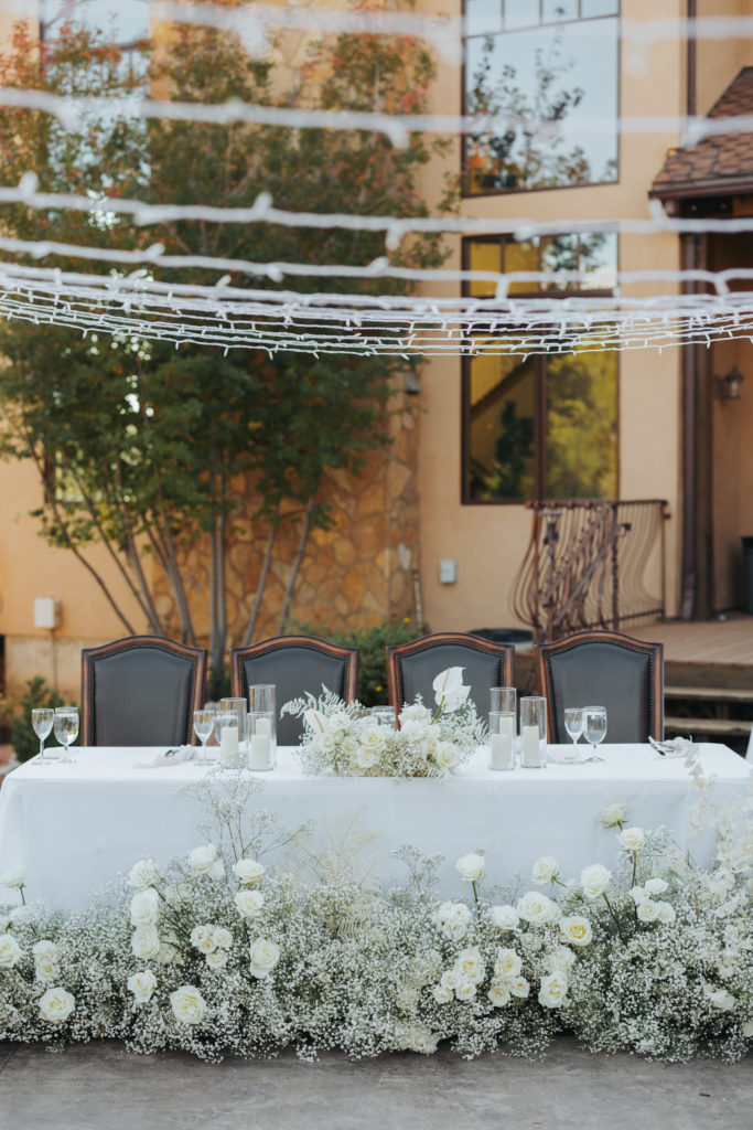 southern utah wedding reception table with white flowers
