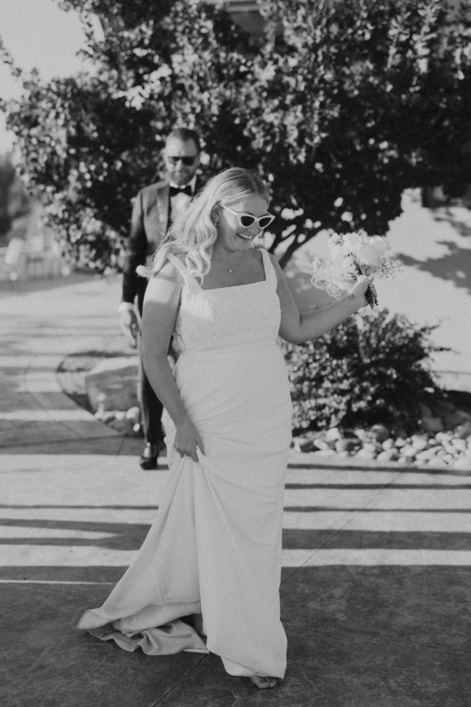 bride and groom walking into wedding reception