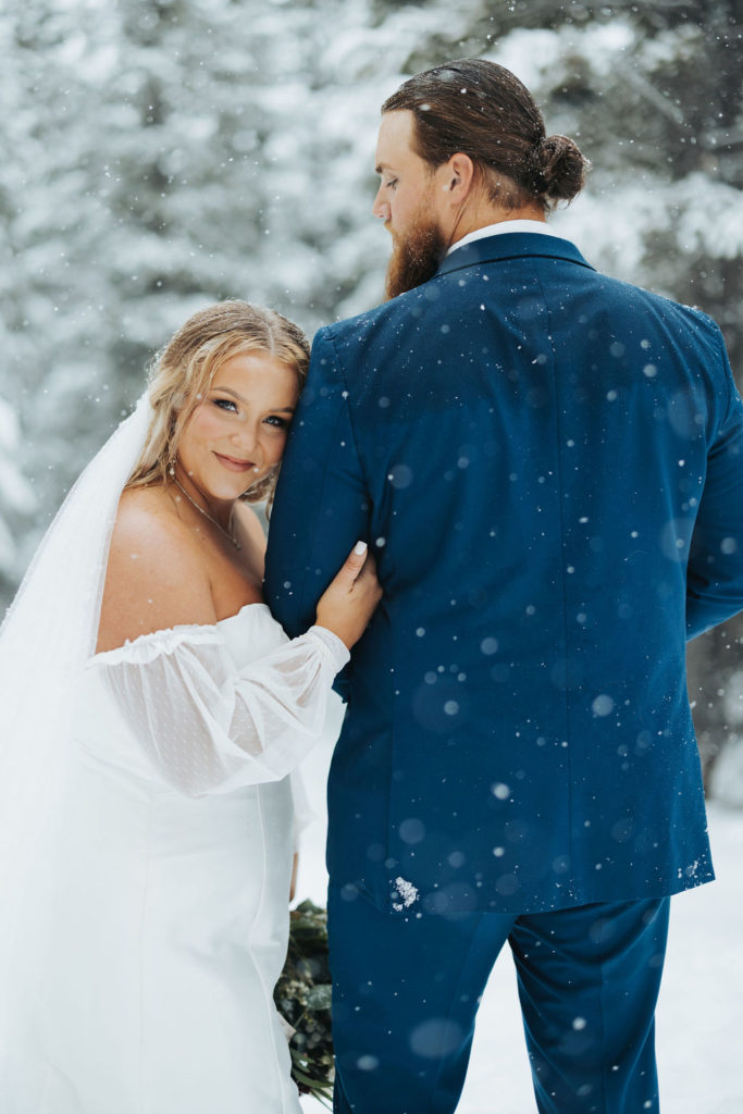 bride and groom portrait in snow