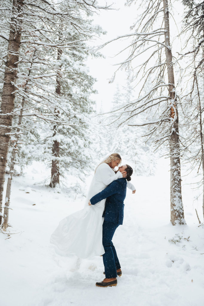 bride and groom elopement portrait in the snow