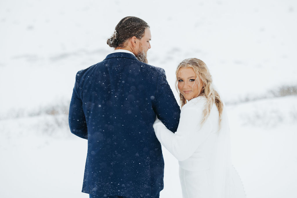 bride and groom portraits in the snow