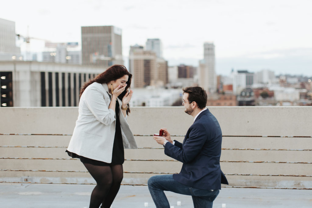 man proposing to woman on birmingham rooftop