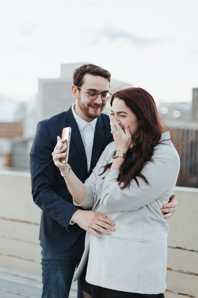 engaged couple facetiming family after proposal