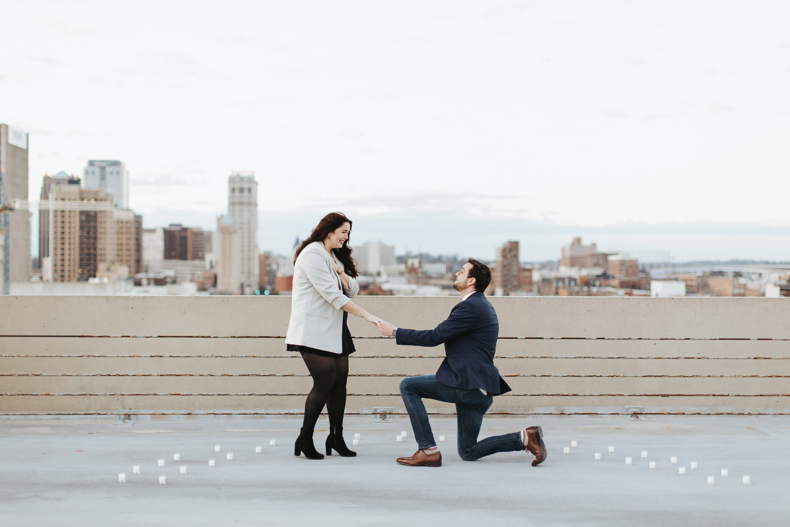 man proposing to woman on birmingham rooftop