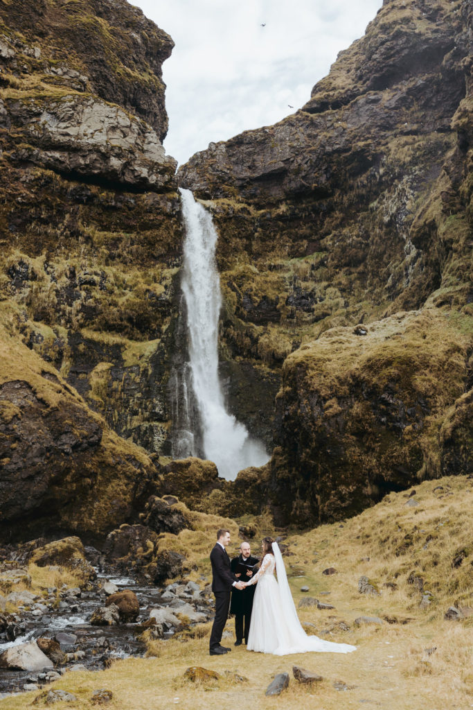 Iceland elopement with waterfall and mountains