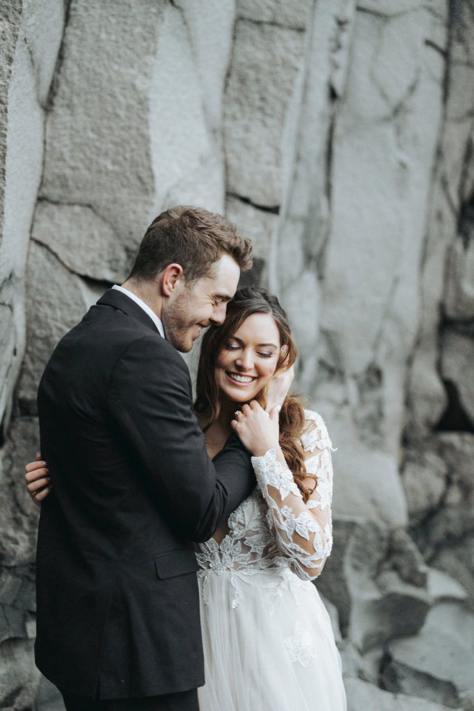 bride and groom elopement on Reynisfjara Iceland rocks