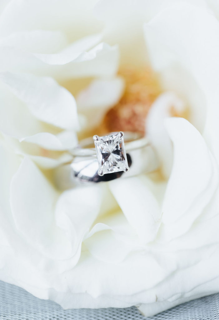 bride's engagement ring in a white flower