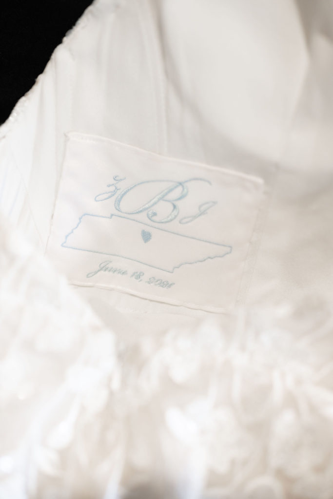 custom blue embroidered tennessee patch with bride's initials inside wedding dress