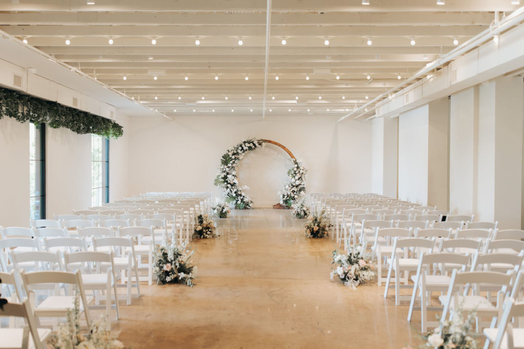 ceremony location at saint elle venue with wooden floral arch