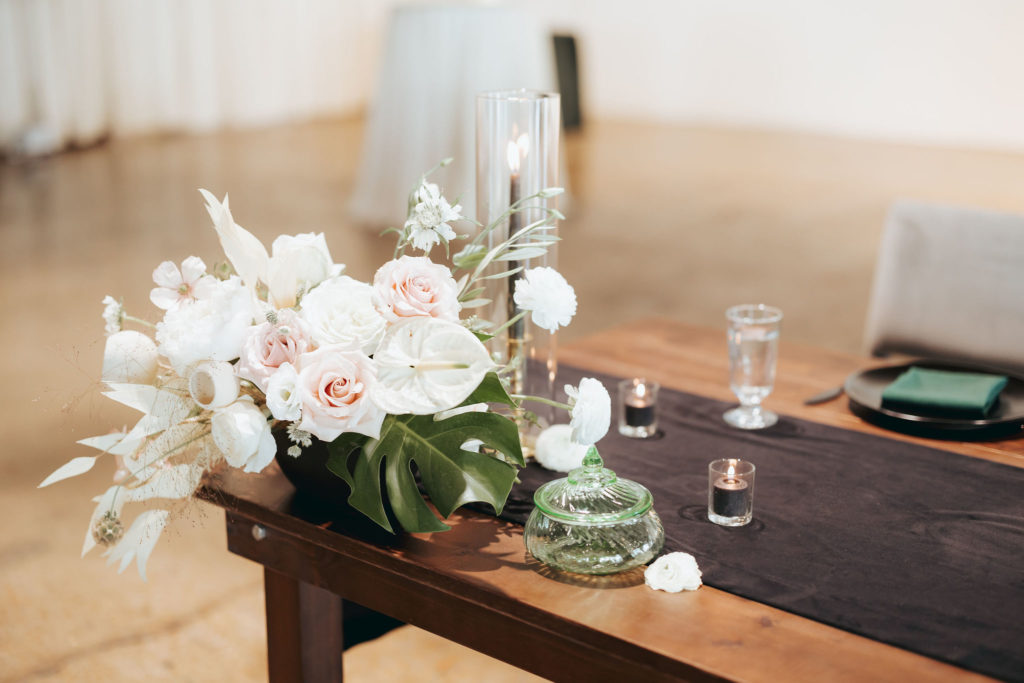 white and blush flowers on reception table