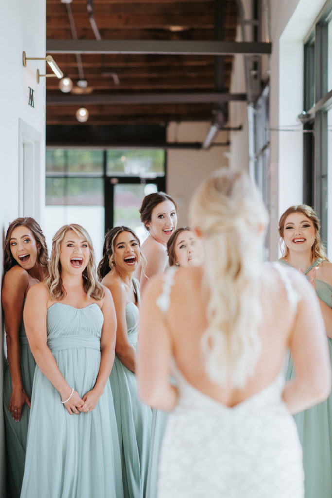 bridesmaid reactions to seeing bride in wedding dress