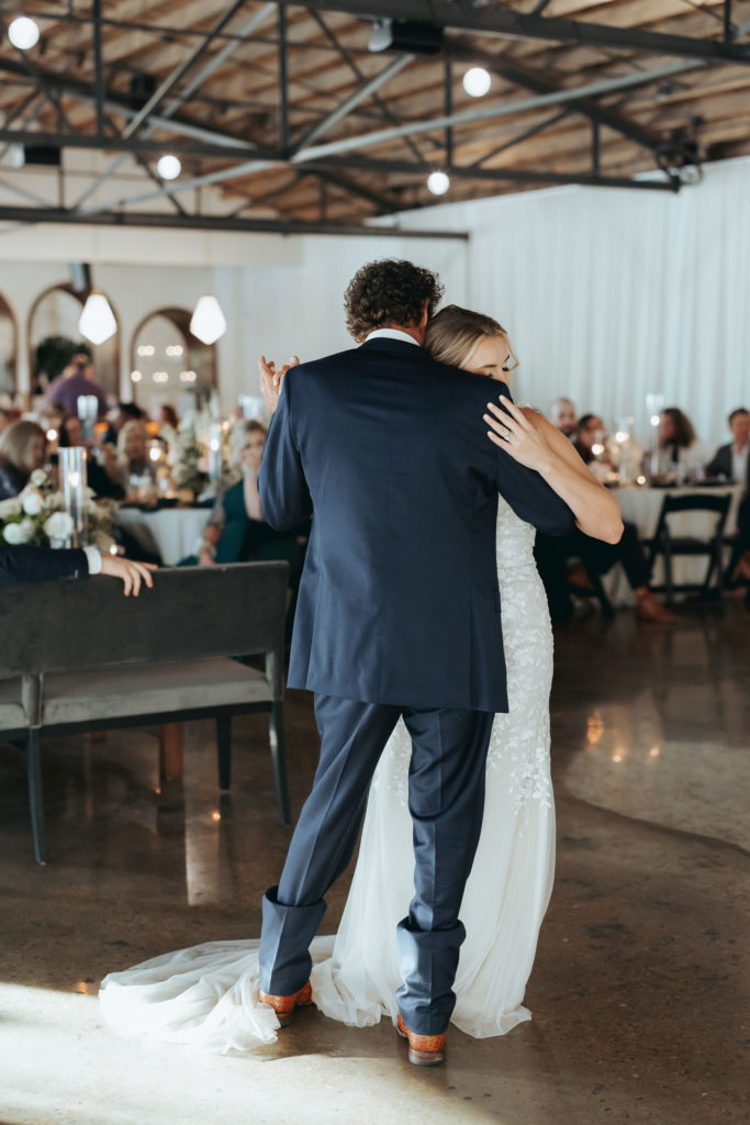 bride dancing with father at wedding reception