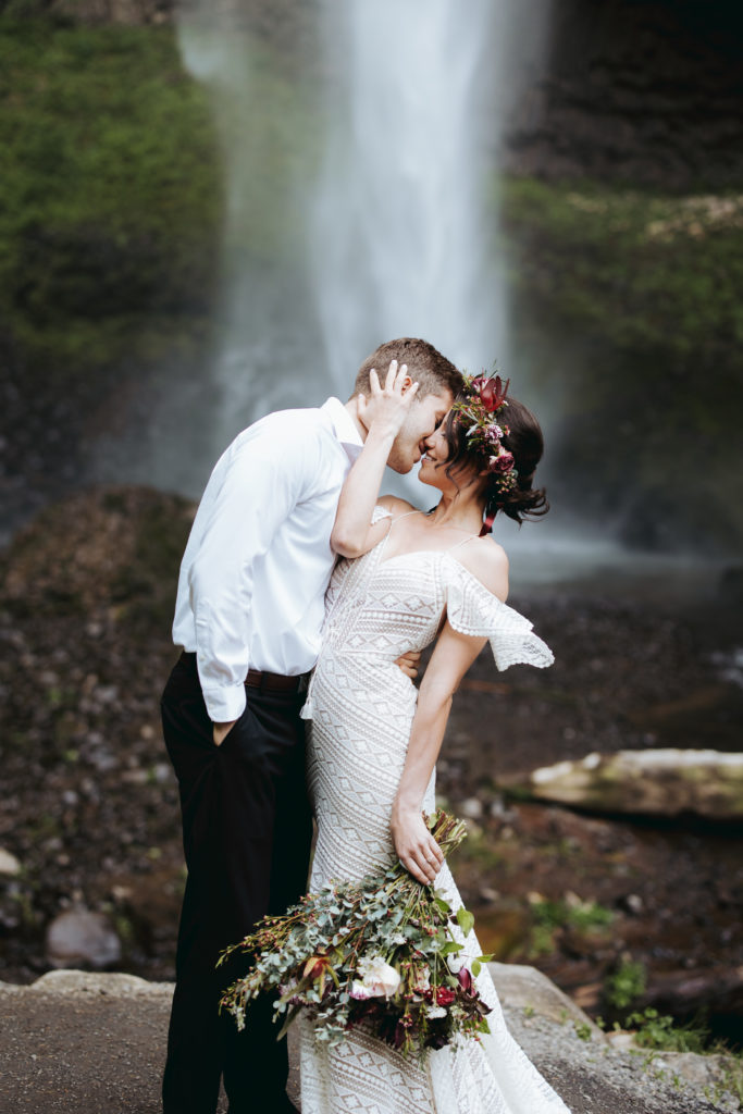 bride and groom at oregon waterfall elopement