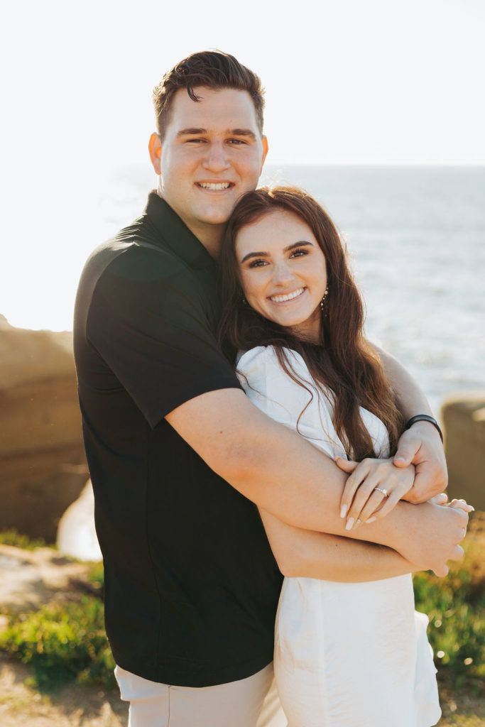 engaged couple on sunset cliffs in san diego