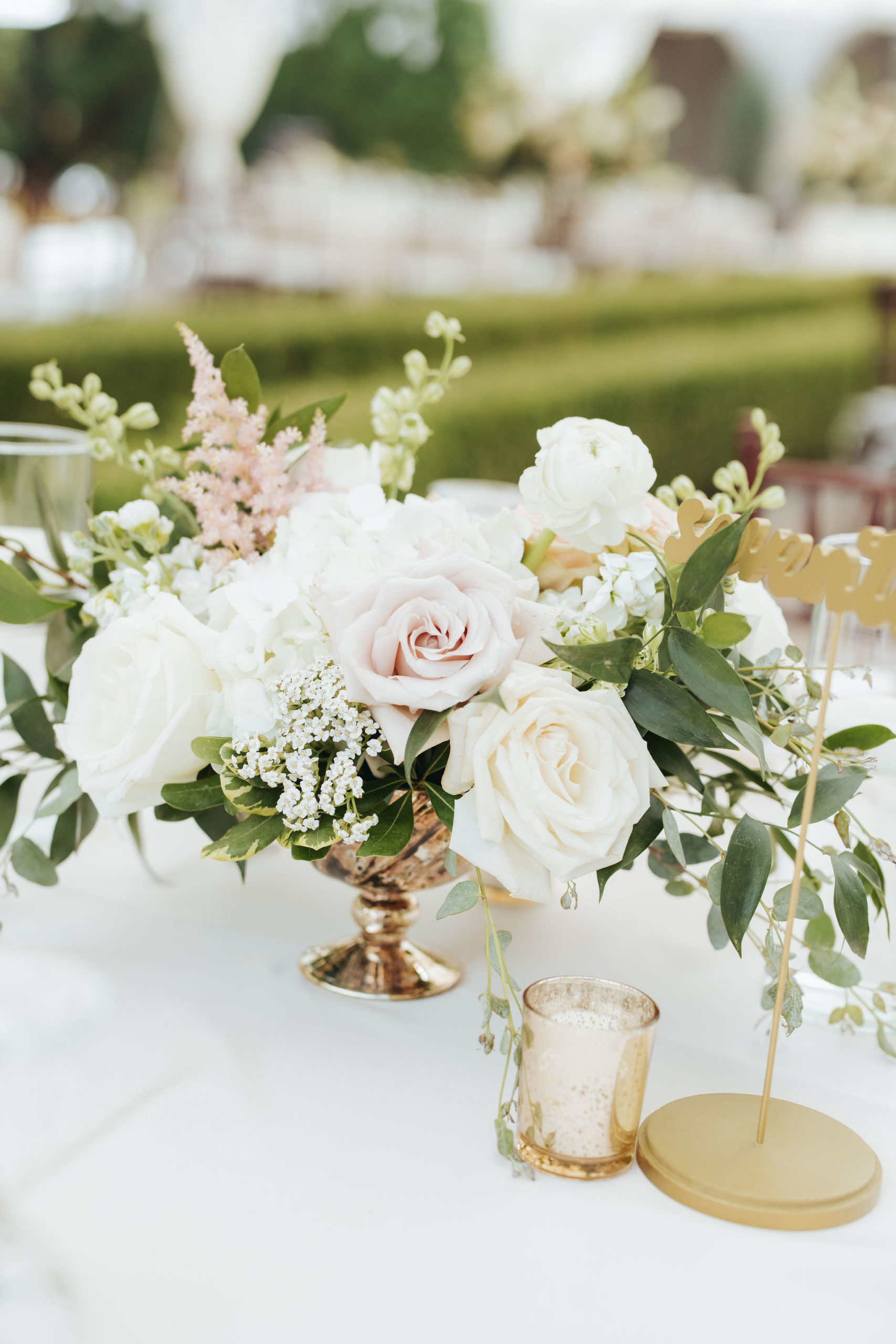 white and blush roses on reception table