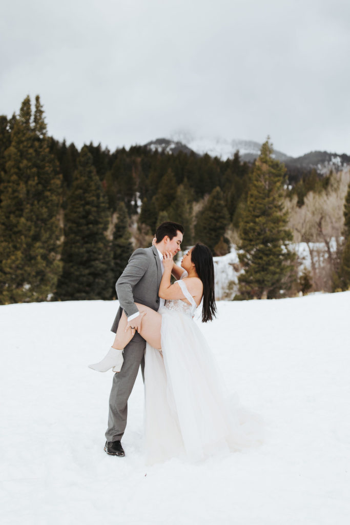 elopement couple on a snowy mountain in utah